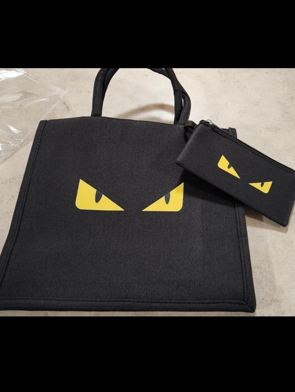 NEW IN PACKAGE Black Tote Bag with Yellow Eye Graphic and Matching Pouch